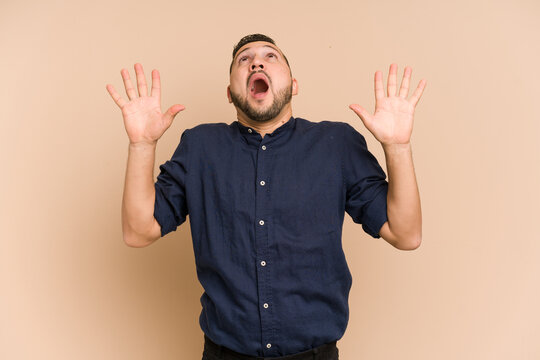 Adult Latin Man Cut Out Isolated Screaming To The Sky, Looking Up, Frustrated.