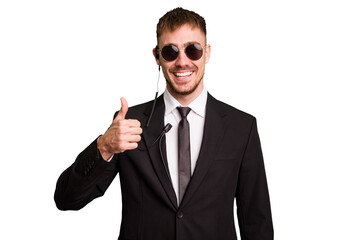Security bodyguard man wearing a suit isolated cut out smiling and raising thumb up