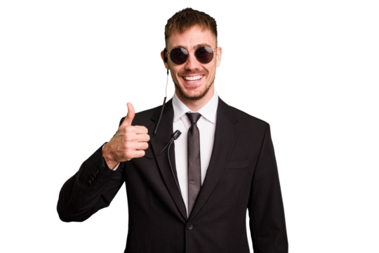 Security bodyguard man wearing a suit isolated cut out smiling and raising thumb up