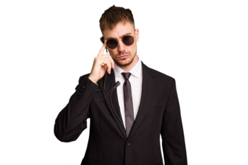 Security bodyguard man wearing a suit isolated cut out pointing temple with finger, thinking, focused on a task.