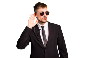 Security bodyguard man wearing a suit isolated cut out trying to listening a gossip.
