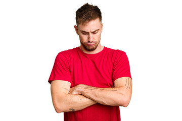 Obraz premium Young caucasian man cut out isolated frowning face in displeasure, keeps arms folded.