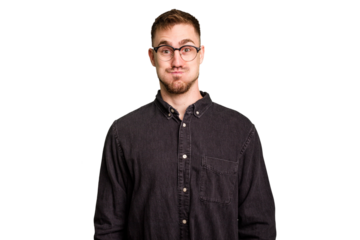 Young caucasian man cut out isolated blows cheeks, has tired expression. Facial expression concept.