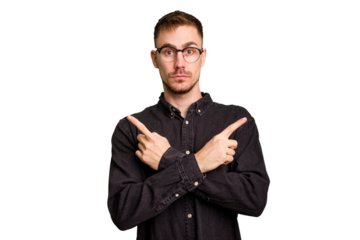 Young caucasian man cut out isolated points sideways, is trying to choose between two options.