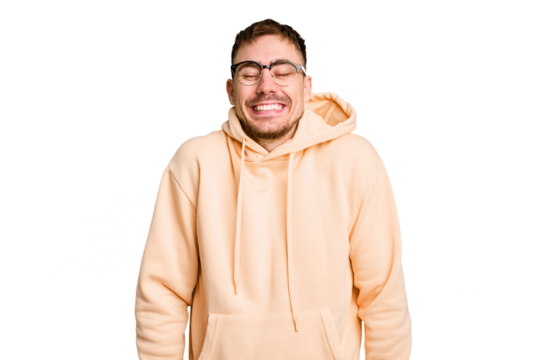 Young caucasian man cut out isolated laughs and closes eyes, feels relaxed and happy.