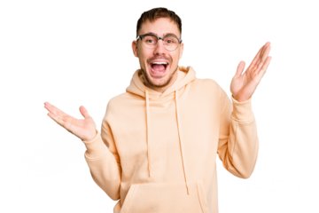 Young caucasian man cut out isolated holds copy space on a palm, keep hand over cheek. Amazed and delighted.