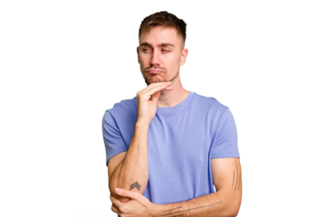 Young caucasian man cut out isolated suspicious, uncertain, examining you.