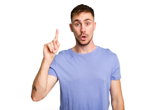 Young caucasian man cut out isolated pointing upside with opened mouth.