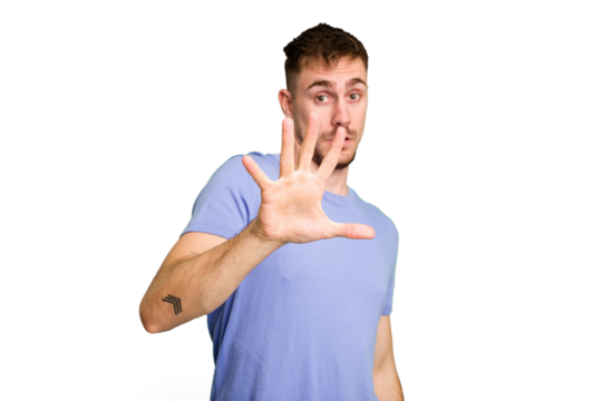 Young caucasian man cut out isolated being shocked due to an imminent danger