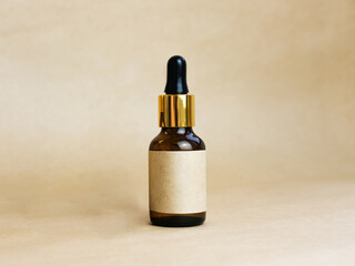 Amber glass pipette bottle with a blank label on a beige background.