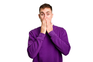 Young caucasian man cut out isolated shocked, covering mouth with hands, anxious to discover something new.