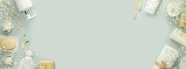 Eco friendly spa relax banner with beauty products, serums, soap, accessories and supplements on blue background. Wellness and skin care treatment. Concept of me time and self care. Copy space