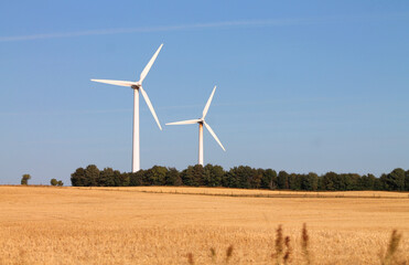 Wind turbines in Denmark producing electricity or power as renewable and environmentally friendly...
