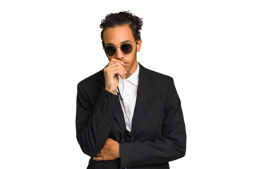 Young African American bodyguard man isolated relaxed thinking about something looking at a copy space.