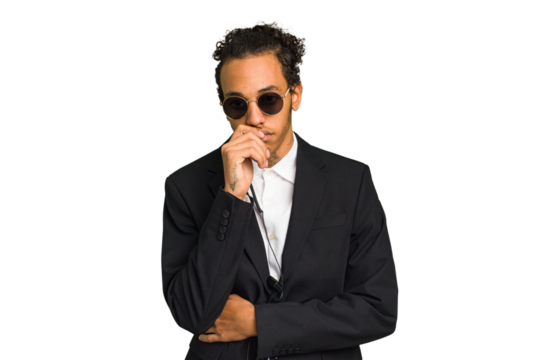 Young African American bodyguard man isolated relaxed thinking about something looking at a copy space.