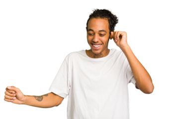 Young African American man isolated dancing and having fun.