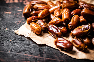 A pile of dates on paper on the table. 