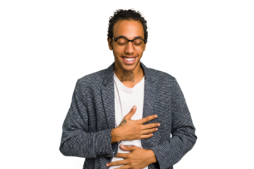 Young African American man isolated laughs happily and has fun keeping hands on stomach.