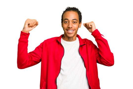 Young African American man isolated cheering carefree and excited. Victory concept.