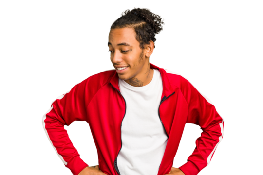 Young African American man isolated laughs happily and has fun keeping hands on stomach.