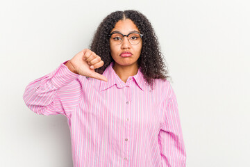 Young african american woman isolated on white background showing a dislike gesture, thumbs down....