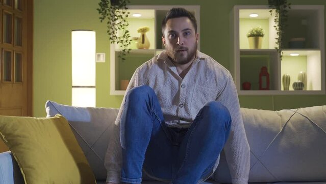The schizophrenic sitting alone at home is afraid of hallucinations.
The madman sitting alone tries to escape from his hallucinations.

