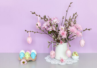 Easter still life with spring bouquet of pussy-willow twigs and pink fresh chrysanthemum flowers...