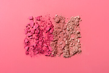 Abstract rectangular composition made from crushed face powder and blush on pink background