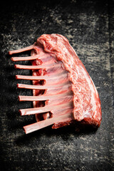 Fresh raw rack of lamb on the table. 