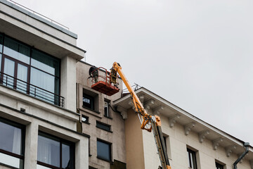 Fototapeta na wymiar worker are restoring facade of a building