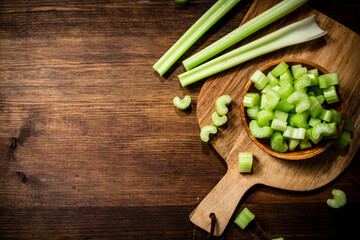 Sliced fresh celery on a cutting board. 