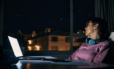 Woman thinking at night, student and laptop for test, distracted girl and notes for exams. Female, lady and academic with pc, dark or planning for task, essay or online reading for education or study