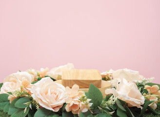 wood podium beige rose flowers on pink pastel background with space.beauty cosmetic skin care advertising stage,luxury romantic love valentines or mother gift, product pedestal platform stand display.