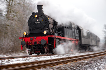 Fast steam train in motion on the Ruhr valley line (Ruhrtalbahn) between Schwerte and Winterberg....
