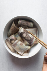 Eating money with chopsticks, eating Nigerian 1000 Naira notes  with chopsticks