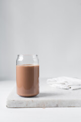 Mocha latte in a can shaped glass, iced mocha with chocolate syrup