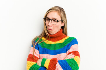 Young caucasian woman isolated on white background tired of a repetitive task.