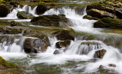 Water concept,river water flowing with light reflecting ,long exposure,light spots,


