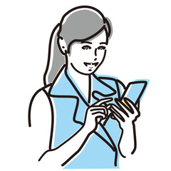 スマホを見て微笑む働く女性