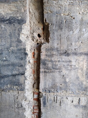 "tear" in the wall for placement of conduit