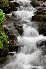 Water concept,river water flowing with light reflecting ,long exposure,light spots,

