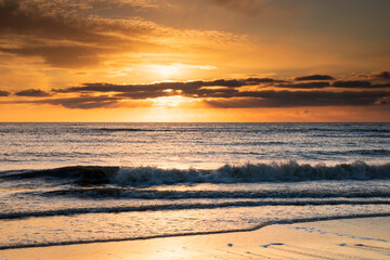 Naklejka na ściany i meble beautiful sunset over North sea beach