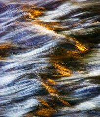 Water concept,river water flowing with light reflecting ,long exposure,light spots,grunge...