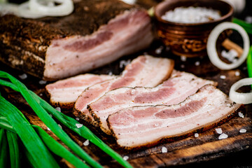 Pieces of lard on a cutting board.