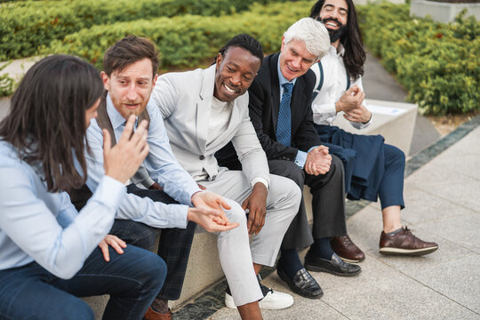 Multiethnic business men having fun outside of the office - Focus on african man face
