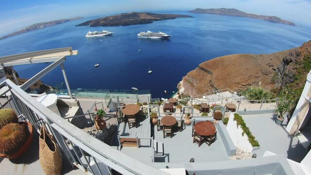Cafe on the terrace with a beautiful sea view of Santorini island, Greece