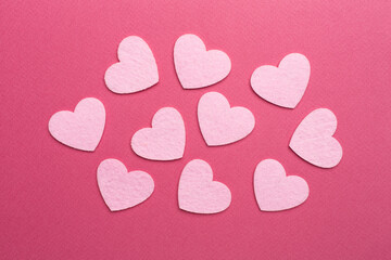 Fototapeta premium Felt hearts on color background, top view