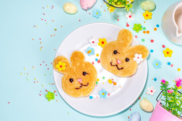 Bunny shaped pancakes for cute Easter holiday, with sugar sprinkles, Funny kids breakfast or brunch