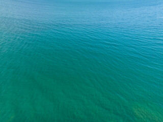 Sea surface aerial view,Bird eye view photo,Top view waves and water surface texture,Green sea background, Beautiful nature Amazing view sea ocean background