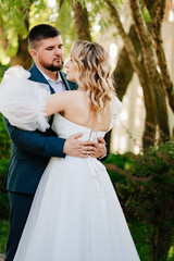 lovers and gentle dancing happy bride and groom in nature. 